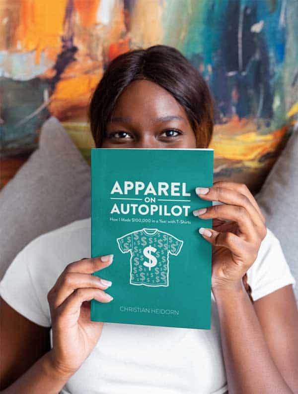 Woman holding copy of eBook "Apparel on Autopilot" by Christian Heidorn